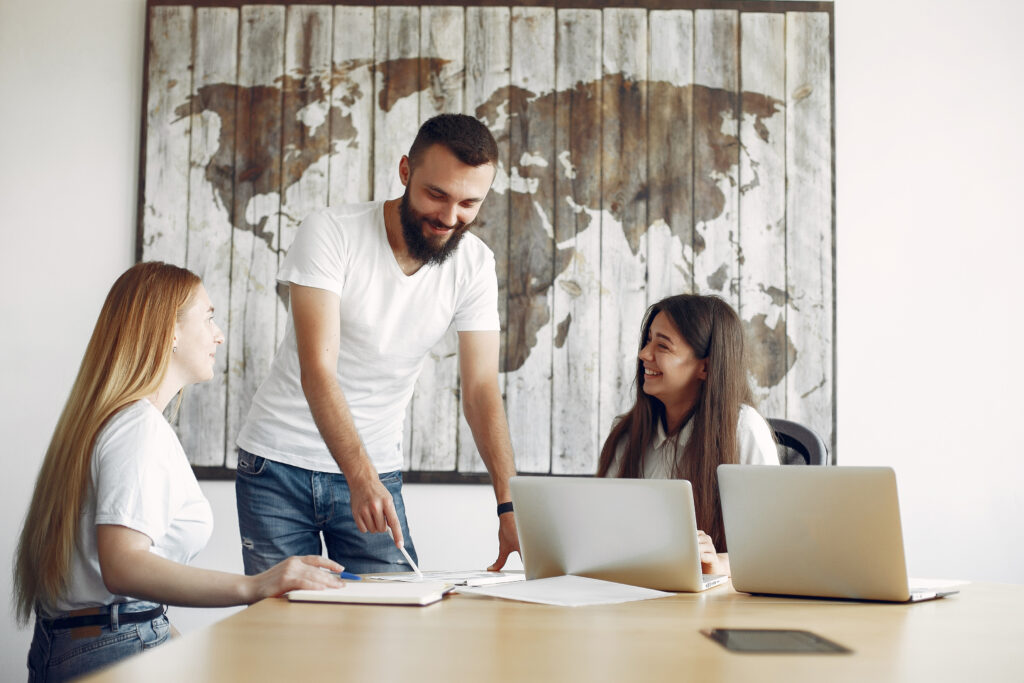 young team working together use laptop